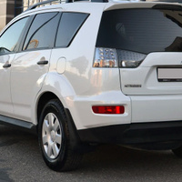 Боковина заднего бампера левая в цвет кузова Mitsubishi OutLander 2 XL (2007-2009) КУЗОВИК